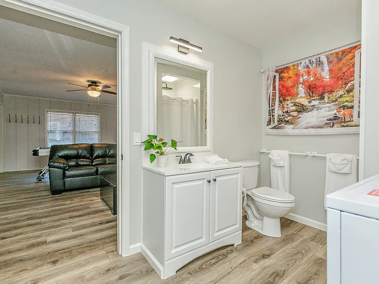 Bathroom for Gameroom and sunroom with stacked full-size W&D
