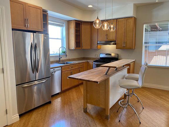 wonderful bright kitchen with double door stove and plenty of storage.