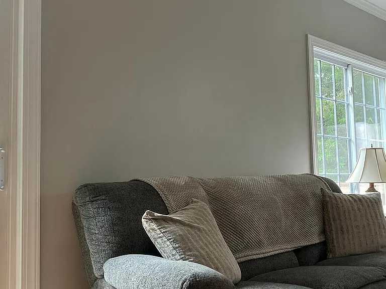 View of freshly painted living room back wall