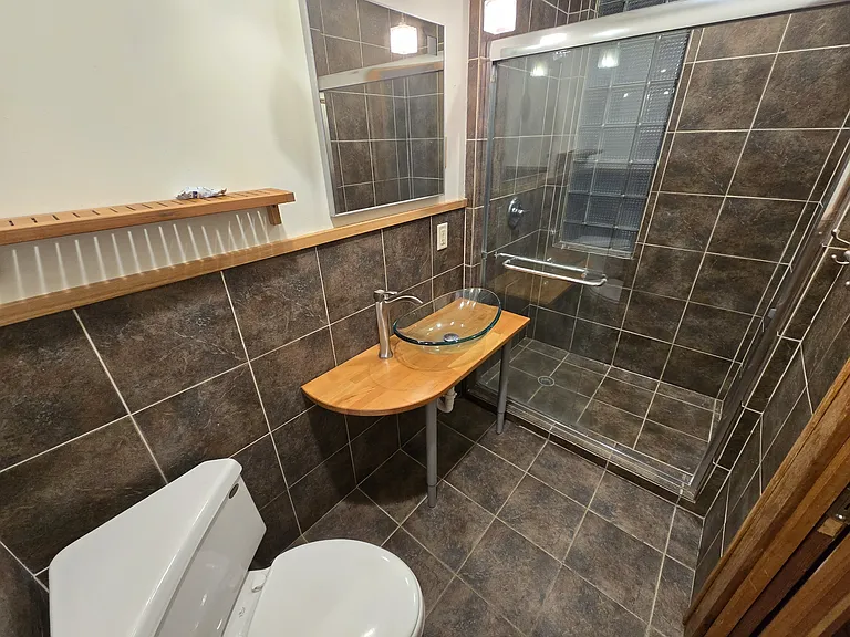 Bathroom, fully tiled and remodeled.