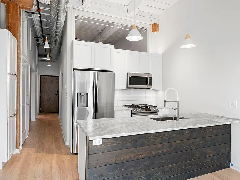 Kitchen with under cabinet lighting, dishwasher, microwave, garbage disposal, etc