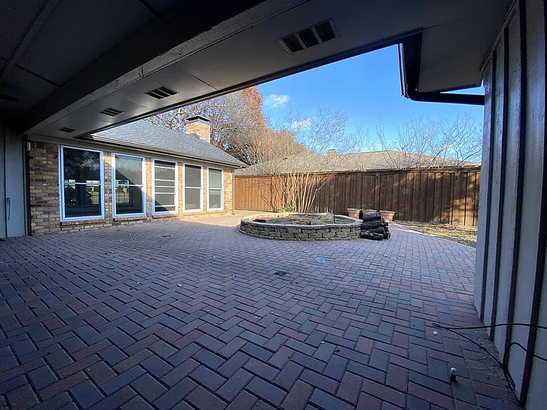 The living room windows overlook the spacious patio