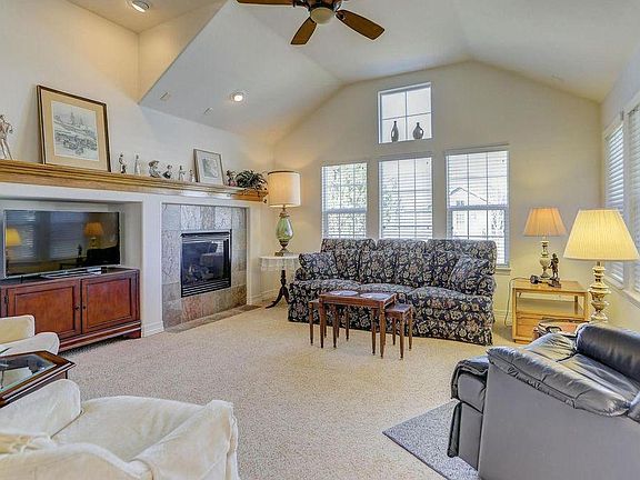 Living room. Note: The carpet on the main level has been replaced and is now a darker grey. The mainlevel has been painted too.