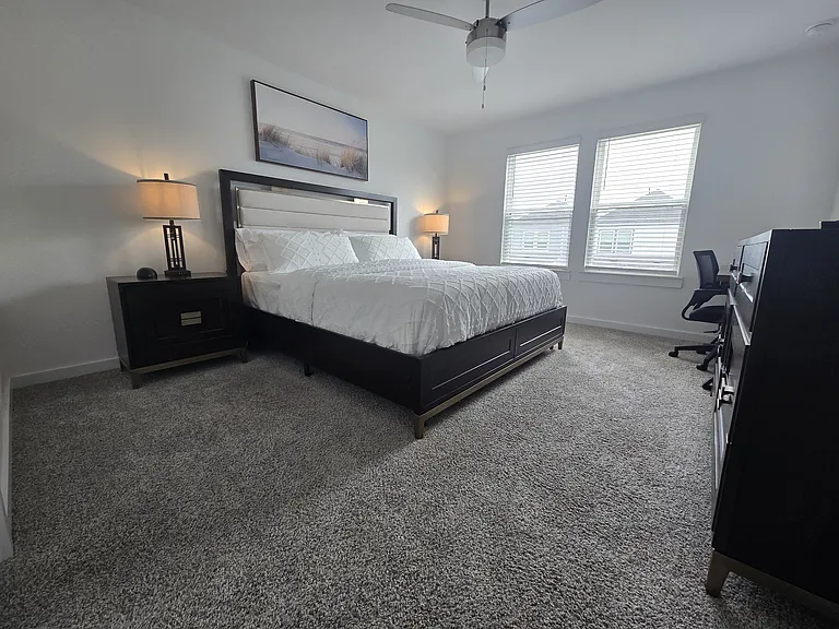 Primary Bedroom with King bed, bed sheets and pillows