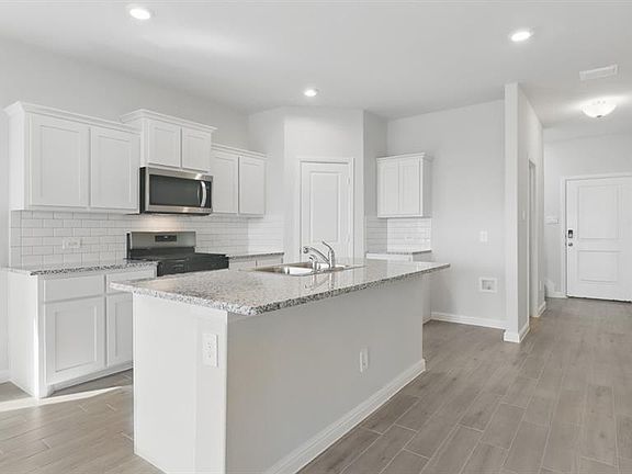 Kitchen-All Home and community information, including pricing, included features, terms, availability and amenities, are subject to change at any time without notice or obligation. All Drawings, pictures, photographs, video, square footages, floor plans, elevations, features, colors and sizes are approximate for illustration purposes only and will vary from the homes as built.