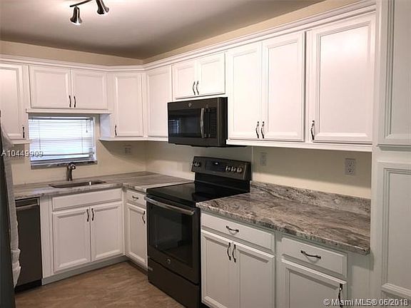 Updated kitchen with new stainless steel appliances.