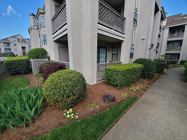 First Floor condo with wrap around patio and outdoor storage