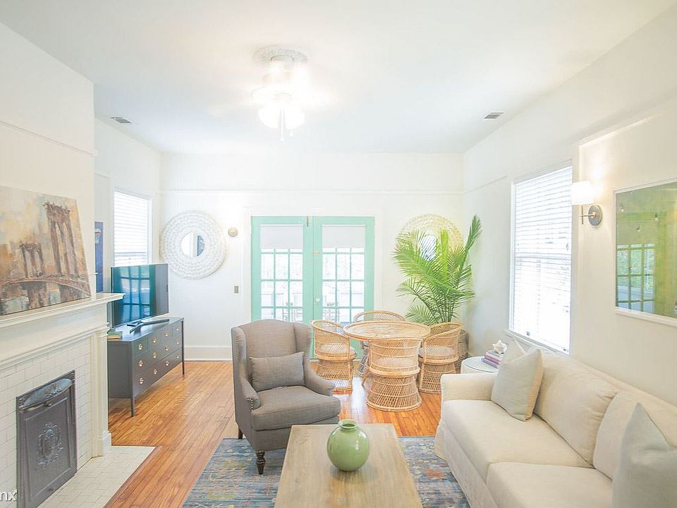 The living room leads to the screened in patio.