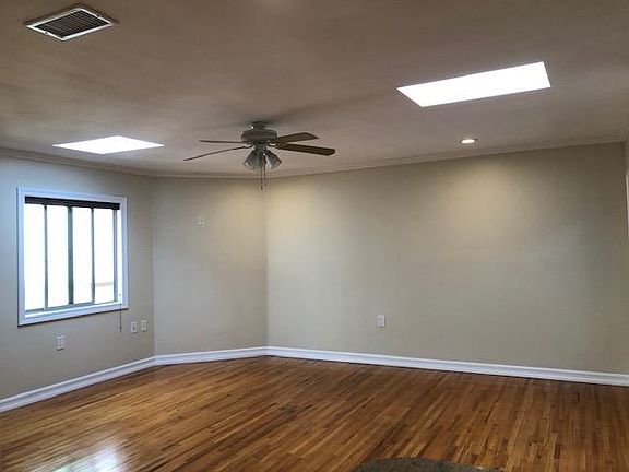 spacious living area with skylights and central ac