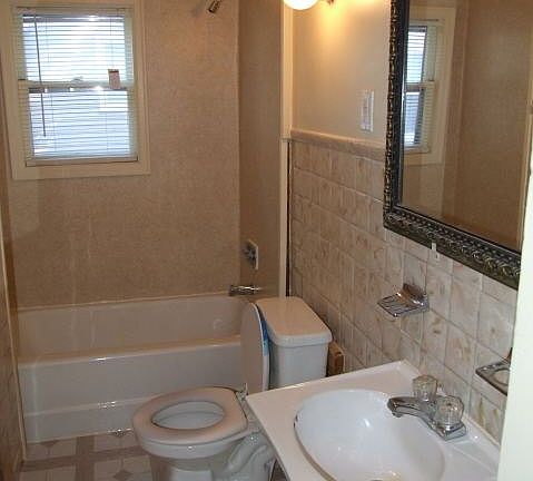 bathroom with tub and shower