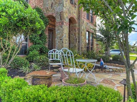 Lovely sitting area out front of home.
