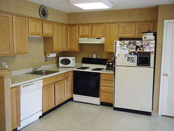 Large Kitchen with Oak Cabinets, Pantry, and Ralph Lauren Paint