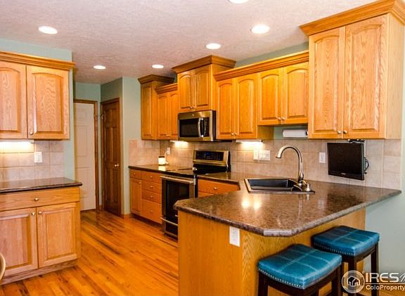 Milarc knotty alder cabinets; breakfast bar