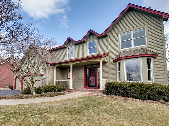 This beautiful home is located on a private walkout wooded lot with a creek in back and a pond in front