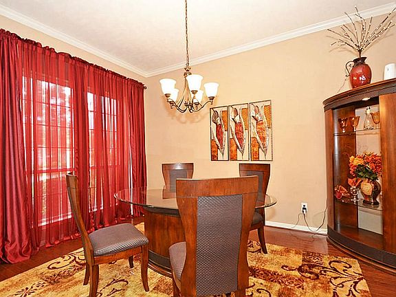  Formal dining room also features wood floors.