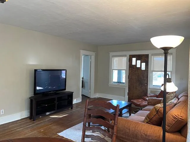 Furnished living room with open floor plan to dining room