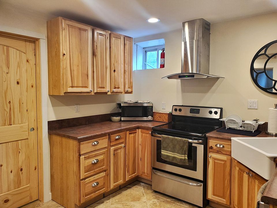 New appliances: glass cook-top stove, farm sink, dishwasher, microwave. Tile floors in kitchen and bath.