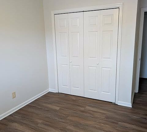 Large bedroom with double closets and brand new flooring & paint.