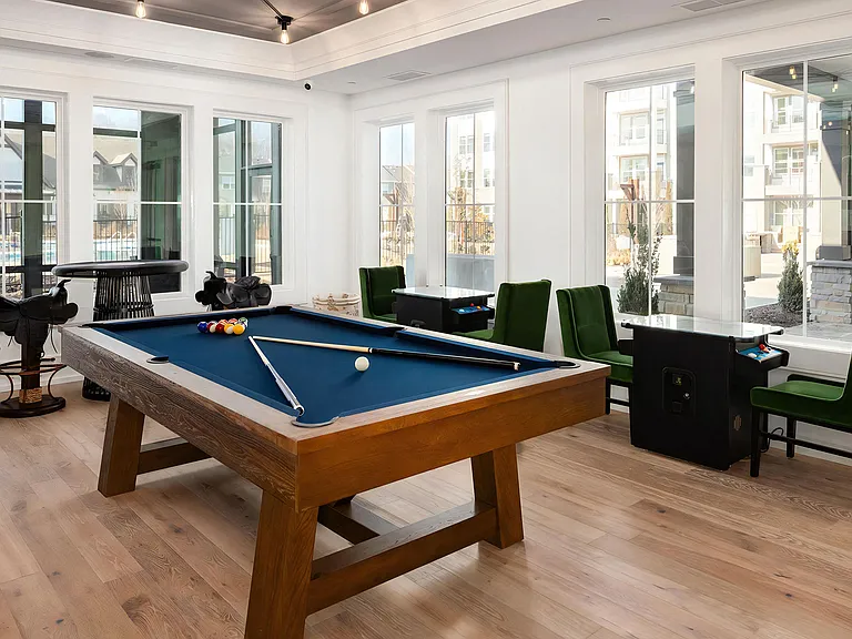 Recreational Game Room with Pool Table and Green Accent Seating