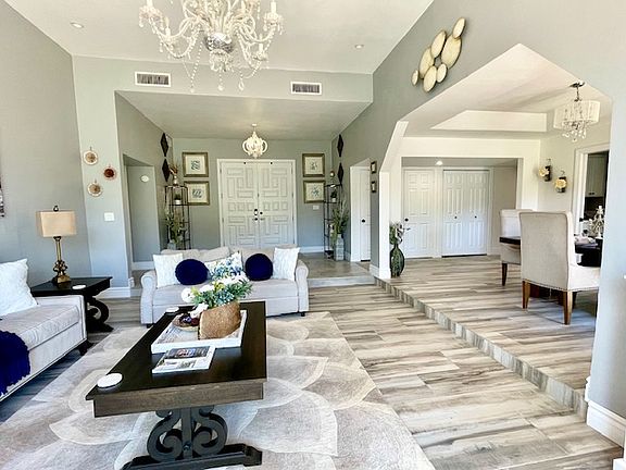 Grand entrance of home includes two custom, oversized doors, complete with keyless entry & 10 second automatic door locking feature.
