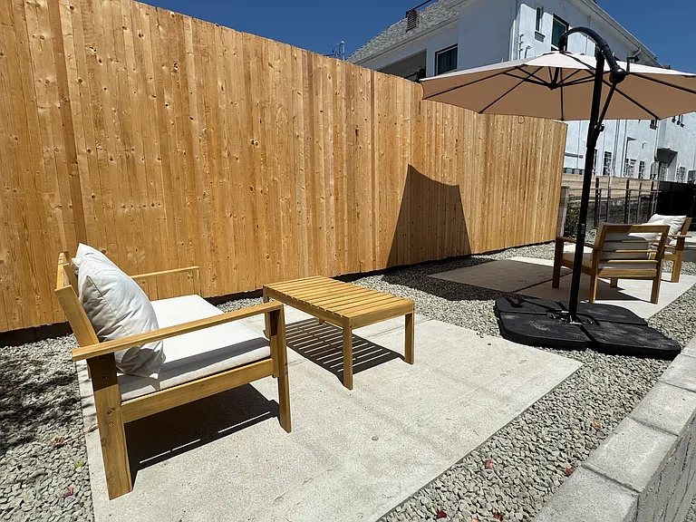 Backyard Outdoor patio accessible from backdoor / stairs of unit.
