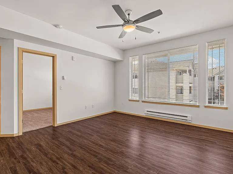 Spacious living area with large windows Spacious living area with large windows