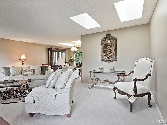 This home has great flow between the living room and dining room, and beautiful natural light through many skylights.