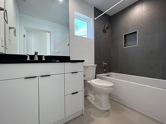 Full bathroom with deep soaking tub