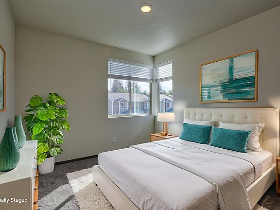 Main bedroom with large corner windows