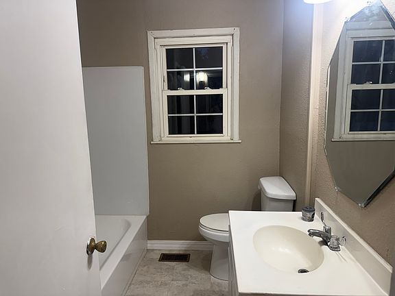 Family bathroom in front of house.