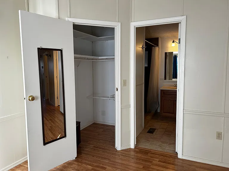 Master bedroom walk in closet and bathroom