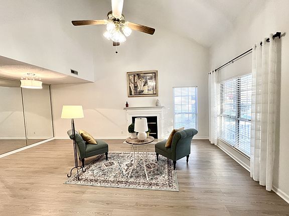 Huge great room with tall ceilings. New floors and paint. Gas fire place.