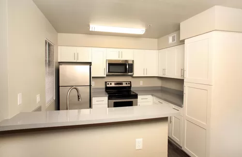 Each kitchen features brand new stainless steel appliances and White slow close cabintry. The Quartz countertops complement any color scheme in the kitchen and bathroom. - Villa Montana Apartments