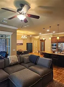 Living room looking into the kitchen and dining area
