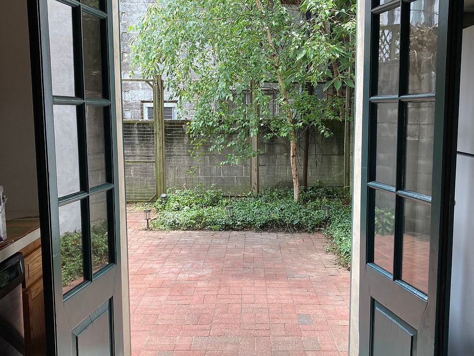 Brick paved patio directly off kitchen.