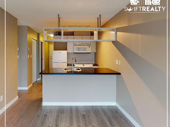 03_1805-1082 _Seymour St_living + kitchen_04172025