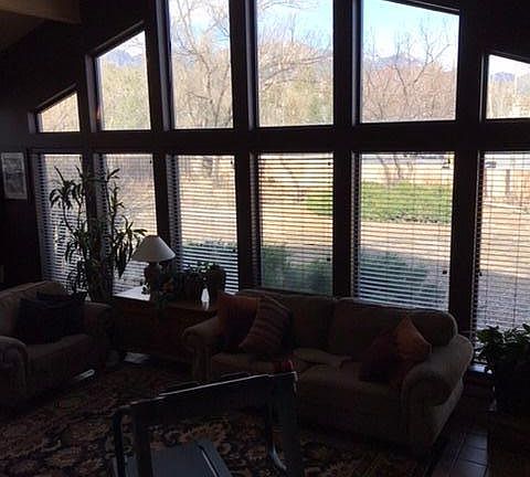 Sunroom, located entire length of westside of house. Vaulted ceiling, tile flooring. Excellent lighting, views of mountain range!