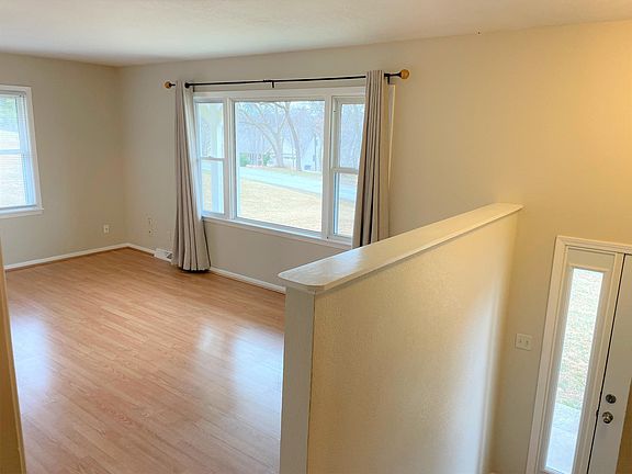 Living room with many windows and entry