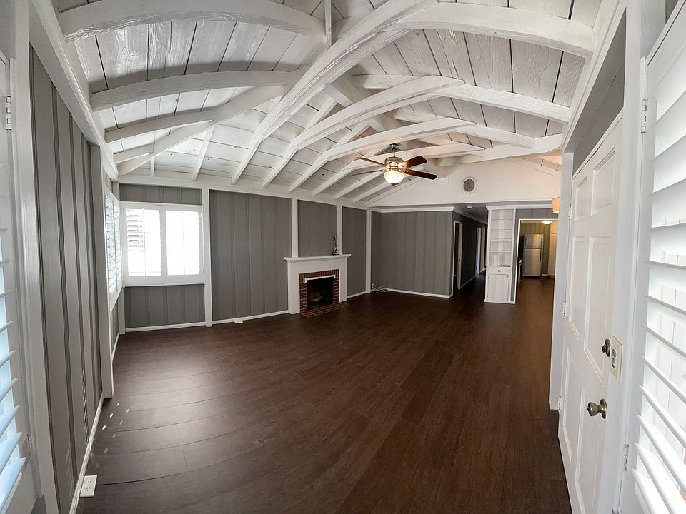 View near entry, front door is on the right. Vaulted ceilings.