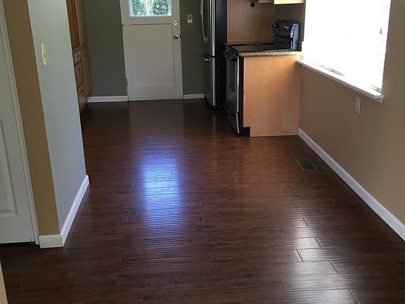 Eating area in kitchen. Back door off kitchen