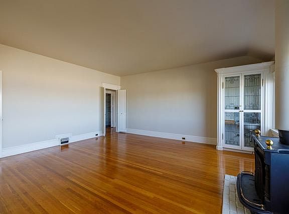 Large Living Room with Wet Bar enclosed behind Leaded Glass French Doors