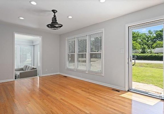 Gorgeous home featuring hardwoods. What a great living room space, leading right to the backyard!