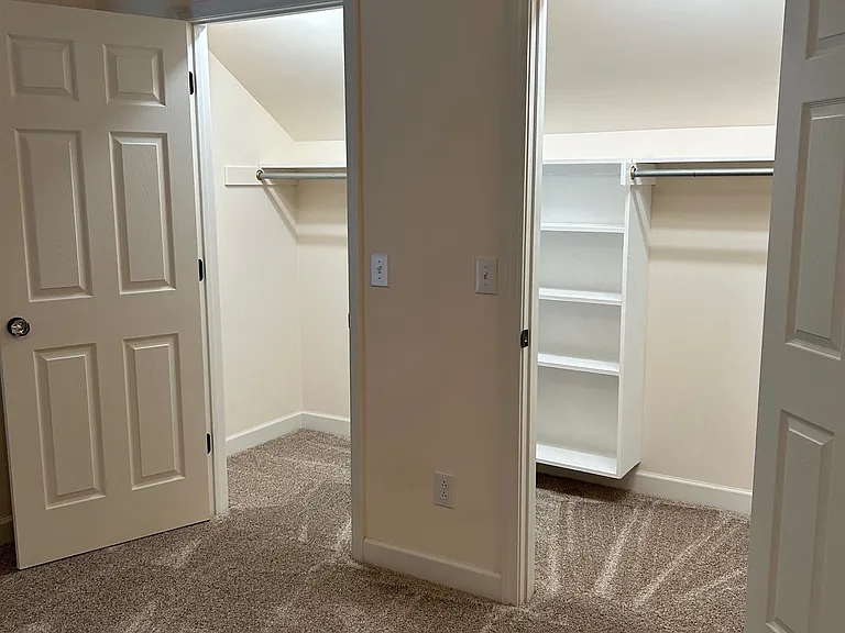 Double-door walk-in closet in bonus room