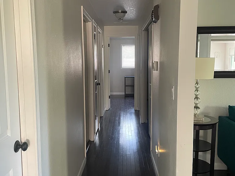 Hallway to bedrooms, laundry room and garage.