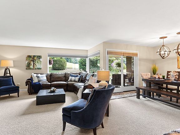 The open floorplan is great for entertaining. The windows and slider were replaced in 2011 with new ones that are double-paned, energy efficient and have noise reducing glass.