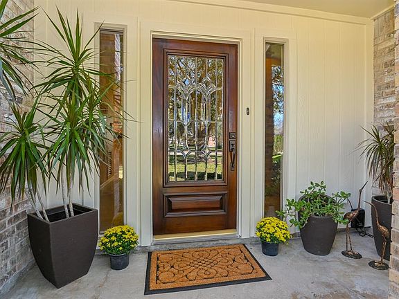 Beautiful leaded glass front door greets you as you enter the home