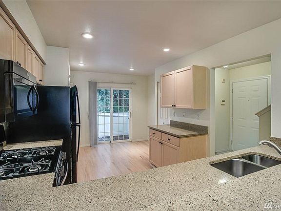 Great kitchen layout with plenty of space for a table or work area next to slider.