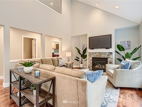 Living room is light filled and open. Large enough for many furniture placement opportunities.