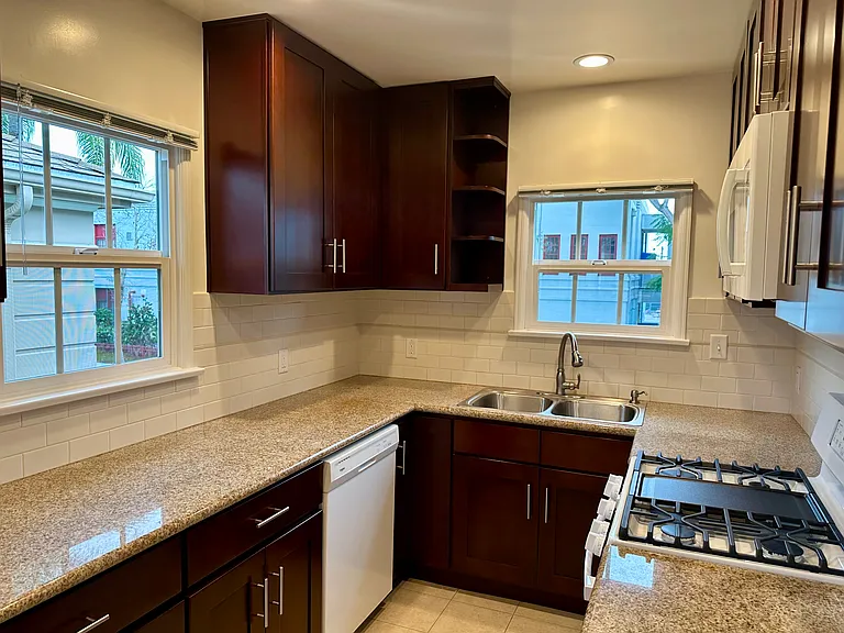 Kitchen - dishwasher, gorgeous cabinets and smooth countertop