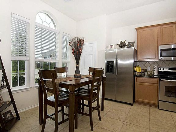 The kitchen has a great eat-in breakfast area in front of a wall with a large window - allowing plenty of natural light.